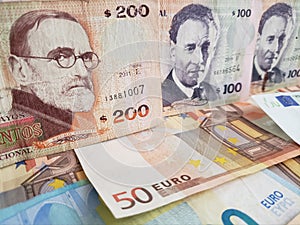 uruguayan banknotes and euro bills of different denominations