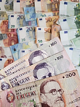 uruguayan banknotes and euro bills of different denominations