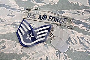 US AIR FORCE branch tape and Staff Sergeant rank patch and dog tags on digital tiger-stripe pattern Uniform