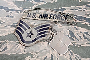 US AIR FORCE branch tape and Staff Sergeant rank patch and dog tags on digital tiger stripe pattern uniform