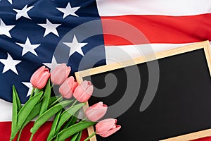 US American flag with blackboard and tulip on white background. For USA Memorial day, Presidents day, Veterans day, Labor day,