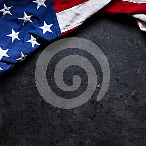 US American flag on worn black background. For USA Memorial day, Veteran`s day, Labor day, or 4th of July celebration.