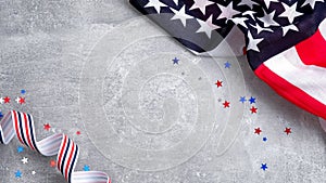 US American flags and confetti star on concrete stone background with copy space. Banner mockup for Presidents day, USA Memorial