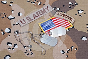 US ARMY airborne tab with blank dog tags on camouflage uniform