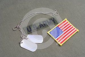 US ARMY Branch Of Service Tape with dog tags and flag patch on olive green uniform