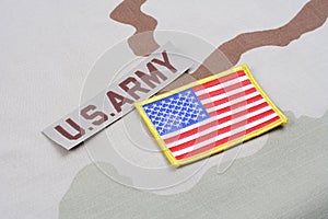 US ARMY branch tape and US flag patch on desert camouflage uniform
