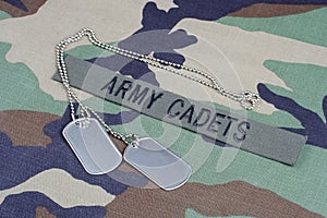 US ARMY CADETS branch tape and dog tags on woodland camouflage uniform photo