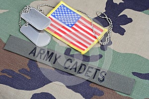 US ARMY CADETS branch tape, flag patch and dog tags on woodland camouflage uniform