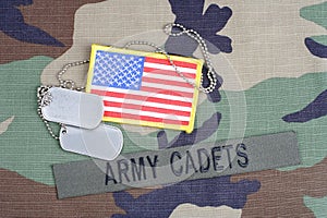 US ARMY CADETS branch tape, flag patch and dog tags on woodland camouflage uniform photo