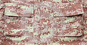 US army camouflage uniform detail background, closeup view