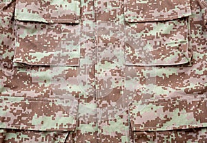 US army camouflage uniform detail background, closeup view