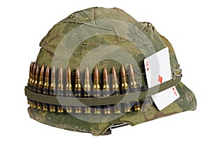 US Army helmet Vietnam war period with camouflage cover, ammo belt and amulet - playing card ace of diamonds
