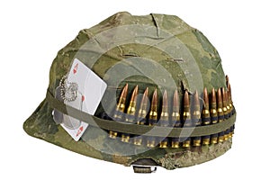 US Army helmet Vietnam war period with camouflage cover and ammo belt, dog tag and amulet ace of hearts playing card