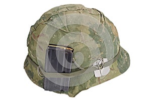 US Army helmet Vietnam war period with camouflage cover, magazine with ammo and dog tags