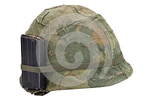 US Army helmet Vietnam war period with camouflage cover, magazine with ammo isolated