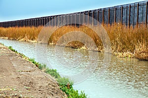 US border fence to Mexico at El Paso photo