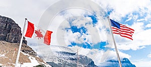 US and Canadian flags in Logan Pass