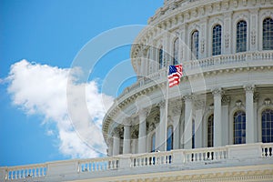 US Capitol in Washington DC detail with flag