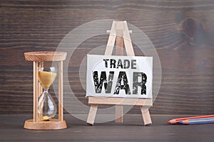 US - China trade war concept. Sandglass, hourglass or egg timer on wooden table