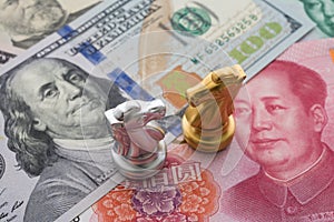 The US and China trade war and currency war concept. Two knights chess face to face competition on US dollar and Chinese yuan