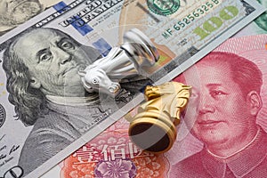 The US and China trade war and currency war concept. Two knights chess lose from competition on US dollar and Chinese yuan