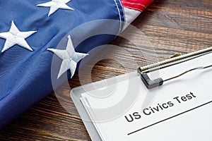 US Civics test for citizenship and USA flag. photo