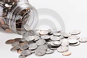 US coins in a jar isolated on white background