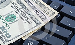 US dollar banknote on the computer keyboard