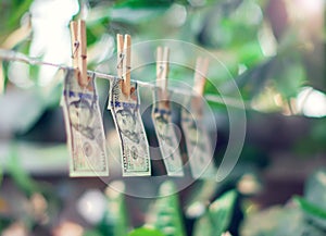 US dollar banknotes hanging on rope money laundering co