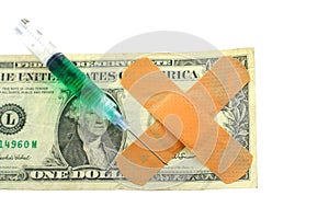 US dollar bill with bandaids