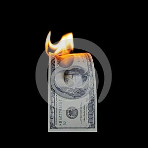 US Dollar bill burning in fire flame isolated on black