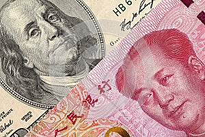 US dollar bill and China yuan banknote macro