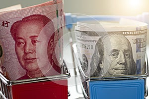 US dollar and China Yuan banknote on shopping cart.Its is symbol for tariff trade war crisis between United States of America and