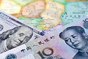 US dollar and chinese yuan on the map of Africa