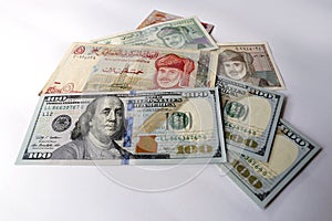 US dollar and Omani Riyal on white background