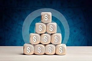 US dollar symbol on wooden cubes against money background. Financial growth, profit, investment or savings in business