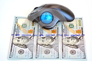 US Dollars bills and computer mouse