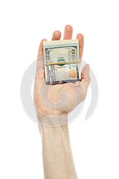 US dollars cash money in male hand isolated on white background. American Dollars 100 banknote