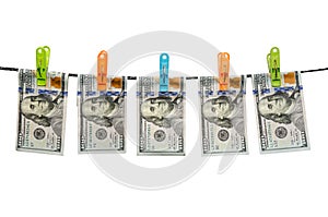 Us dollars are drying on cord isolated on white background