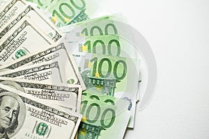 US dollars and euro banknotes texture. white Background of one hundred dollar and euro bills.