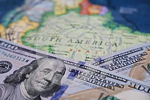 US dollars on the map of South America photo