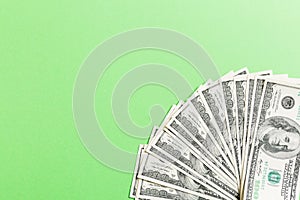 US Dollars: Untidy fan of various US dollar bills Top view of business concept on colored background