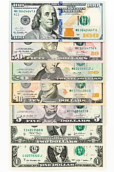 US dollars on white. 1, 2, 5, 10, 20, 50 and 100 dollar bills