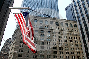 US Flag on the background of the Federal Reserve building in New York