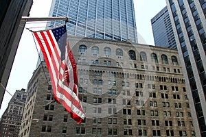 US Flag on the background of the Federal Reserve building in New York photo