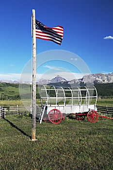 US Flag and covered wagon, Hastings Mesa, near Ridgway, Colorado, USA