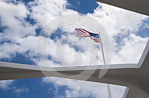 US Flag flies over the USS Arizona memorial