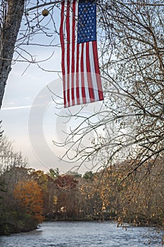 US Flag Flutters over West Canada Creek during Sunset at Barveveld, New York