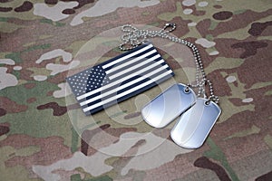 US flag patch with dog tag on multicam camouflage uniform