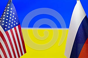 The US flag and Russian flag on the background of the Ukraine flag. Flag of USA, Russia and Ukraine. The United States of America